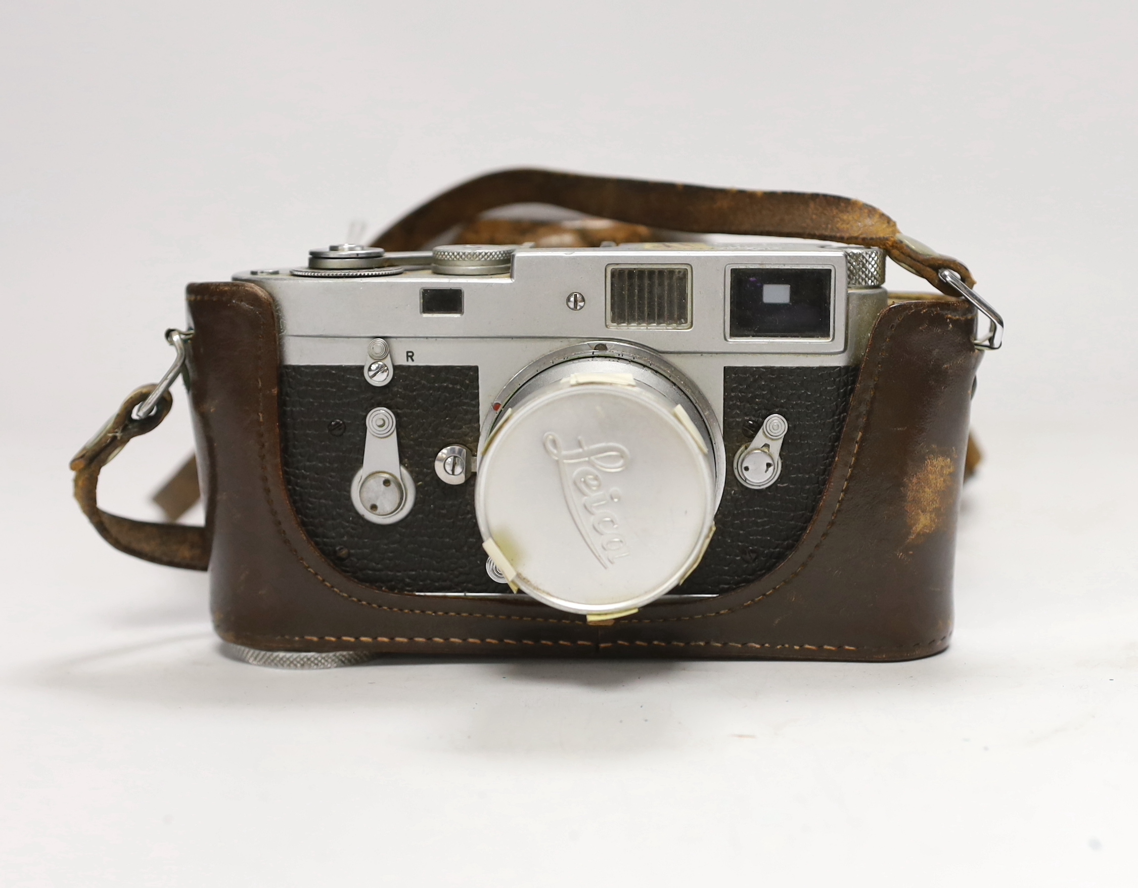 A Leica M2 camera, serial no. 1104070, c.1965, with Summaron f=3.5cm 1:3.5 lens, with leather case and strap